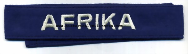 Luftwaffe AFRIKA cuff title machine-embroidered on blue - Luftwaffe Ärmelband Afrika auf blau- Fascia da braccio Luftwaffe AFRIKA su panno blu Luftwaffe AFRIKA cuff title machine-embroidered on blue - Luftwaffe Ärmelband Afrika auf blau- Fascia da braccio Luftwaffe AFRIKA su panno blu